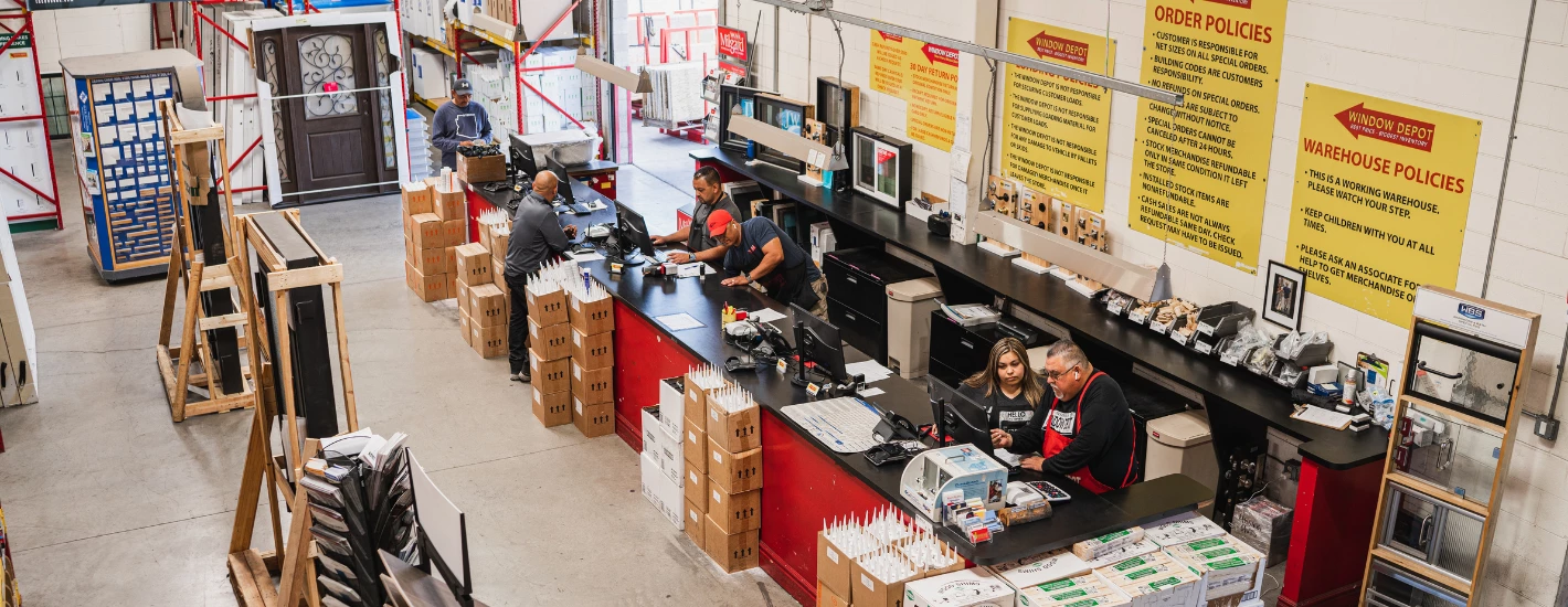 staff helping customers at the window depot service counter